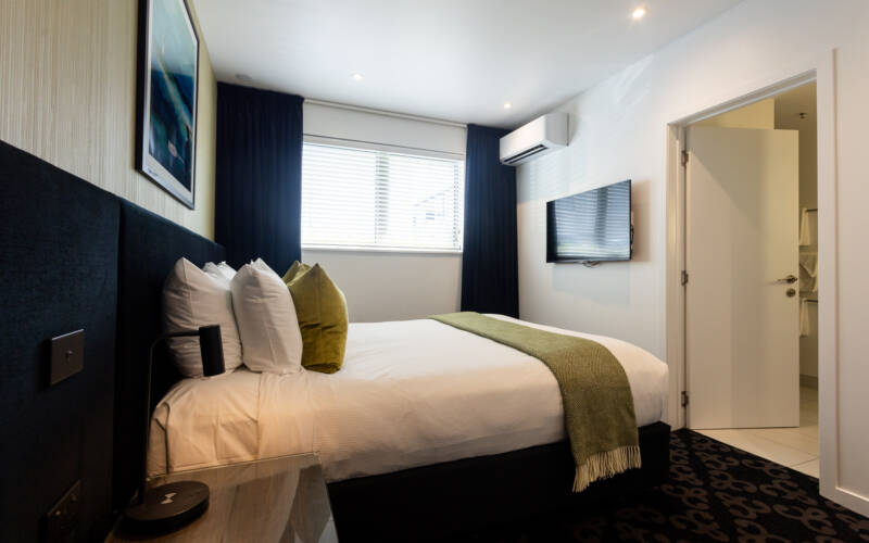 An image of one of the two bedrooms in a 2-bedroom executive suite at Regent of Rotorua
